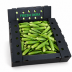Fresh whole green okra in a black produce box on a white background